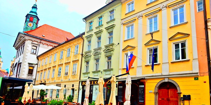 Meander through cobblestone alleys lined with cafes, pastel buildings, and historic facades.