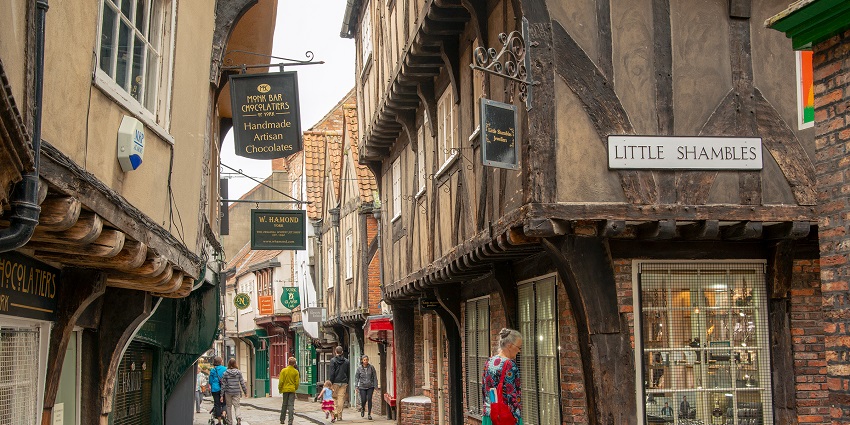 Explore the narrow, medieval lanes of the Shambles, with the rustic urban charm.