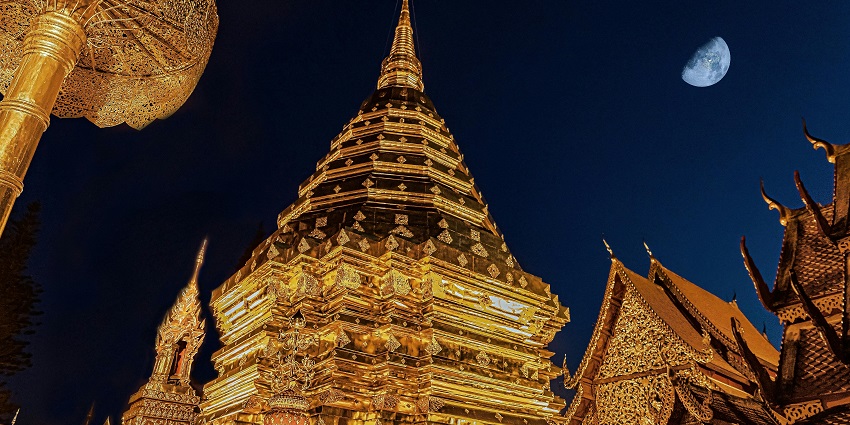 The illuminated Wat Phra That Doi Suthep in Chiang Mai, Thailand, stands majestically
