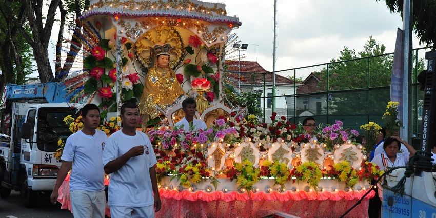 Buddhist devotees participating in the ritual of Wesak Day, a Buddhist festival in Malaysia.
