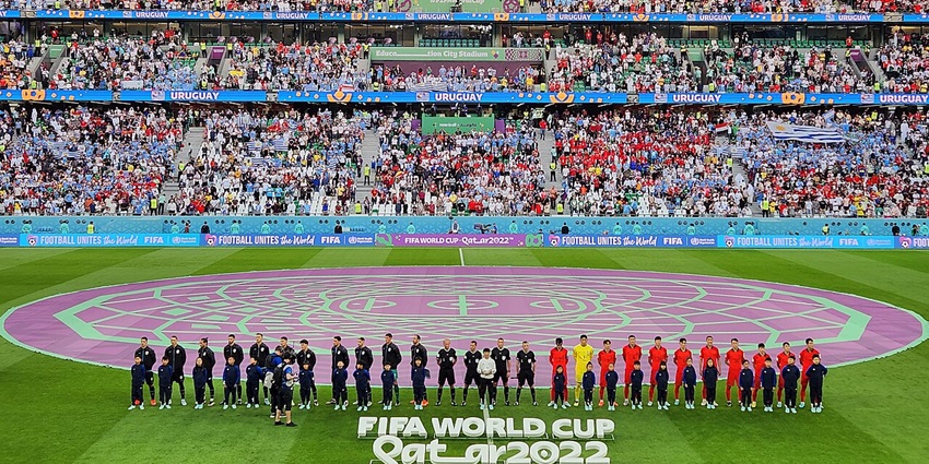Ongoing match of Korea & Uruguay with FIFA World Cup signages and people cheering