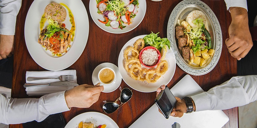 Luxurious dining setup near The Lost Chambers Aquarium offering Middle Eastern cuisine