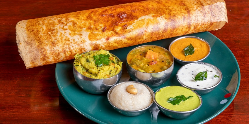 A simple view of South Indian food, which includes Dosa and Sambhar.