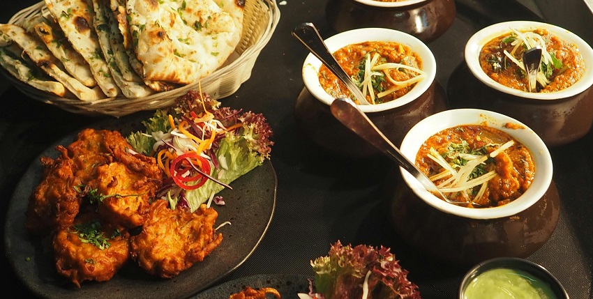 Snapshot of the White and Brown Cooked Dish on White Ceramic Bowls