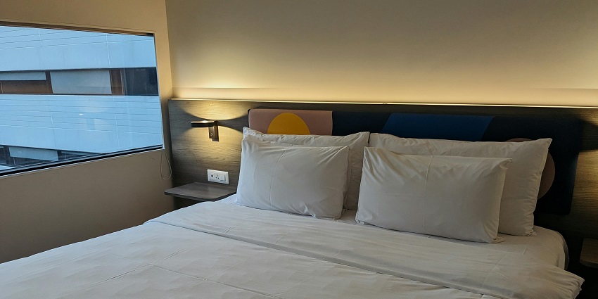 Cozy hotel room with a comfortable bed and modern amenities for a restful stay.”