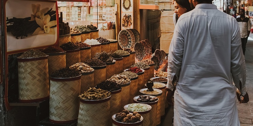 Local market selling spice in tall containers as buyers bargain and buy ahead of celebration