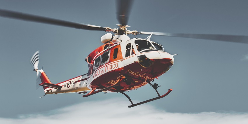 An image showing a view of a helicopter flying over the Antarctic landscape, one of the top things to do in Antarctica.
