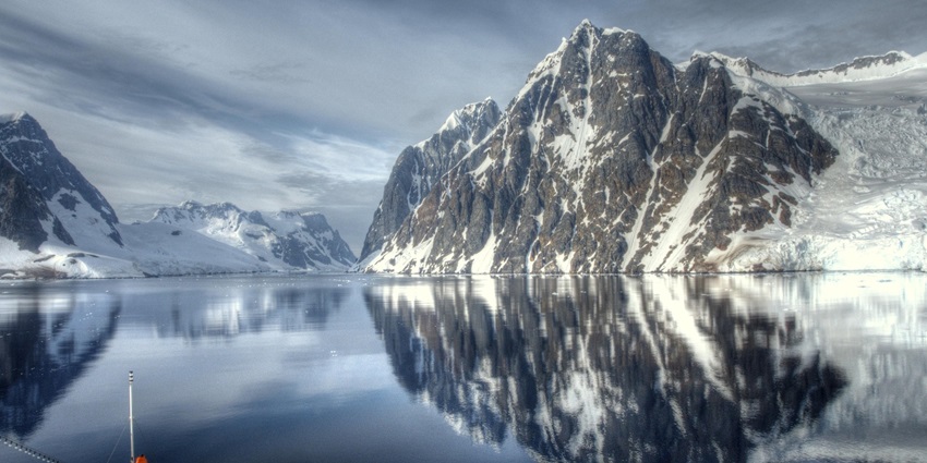 An image showing the narrow and scenic Lemaire Channel, a famous thing to do in Antarctica.