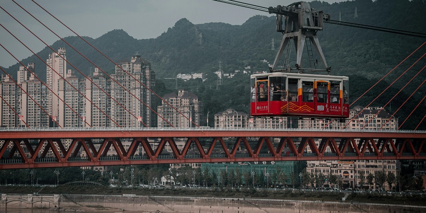 Enjoy panoramic views of the city as you travel across the Yangtze River in a cable car.