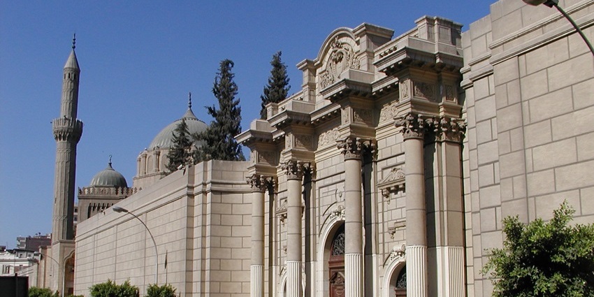 Ornate exterior of Abdeen Palace with decorative gates and fountains, one of the best historical places in Cairo.
