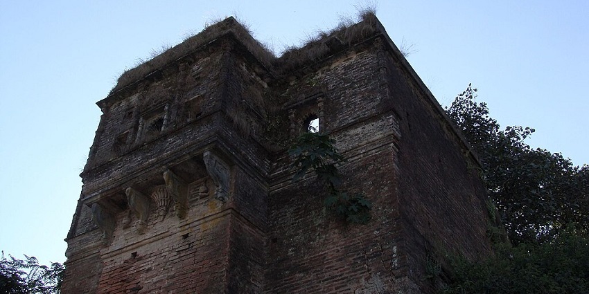 Achalgarh fort with old ruined architectural building of the fort and grass on the fort.