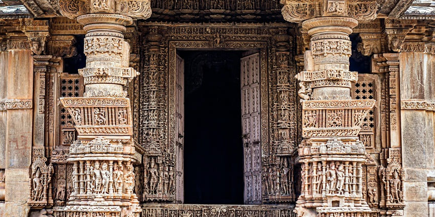 Entrance of the rock-cut Adhar Devi Temple inside a narrow mountain cave.
