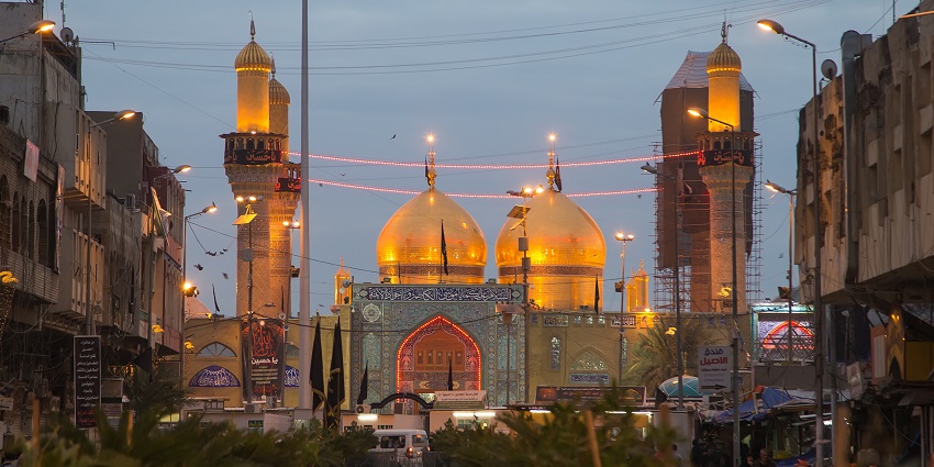 Al Kadhimiya shrine in the evening with the lit-up minarets, domes, one of the Islamic historical places in Iraq.