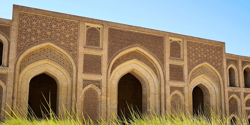 Al-Mustansiriya Madrasah with unique designs on the building’s architecture and long grass