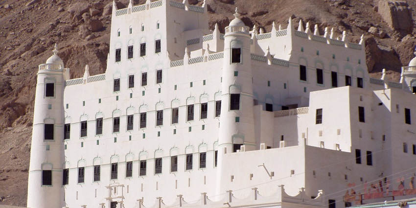 An ancient hilltop fortress with stone walls, towers, and rugged terrain, one of the historical places in Yemen.
Viewers of this file can see comments and suggestions