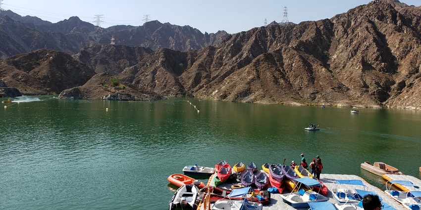 The magical Al Rafisah Dam is surrounded by the equally stunning Hajar Mountains.