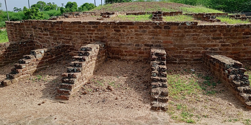 Ancient ruins at Ambaran Buddhist Site with brick stupas and peaceful surroundings