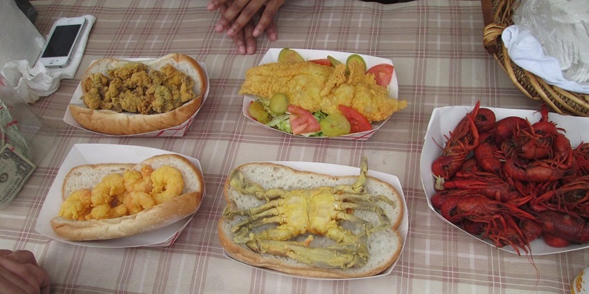 A picture of a variety of seafood served on a table at a restaurant in New Orleans