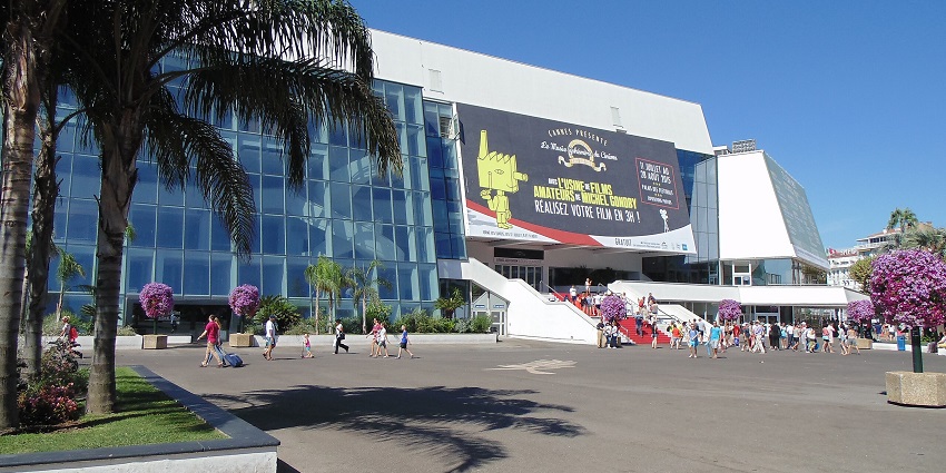 A vibrant tech convention hall with booths, showcasing things to do in Cannes in February.