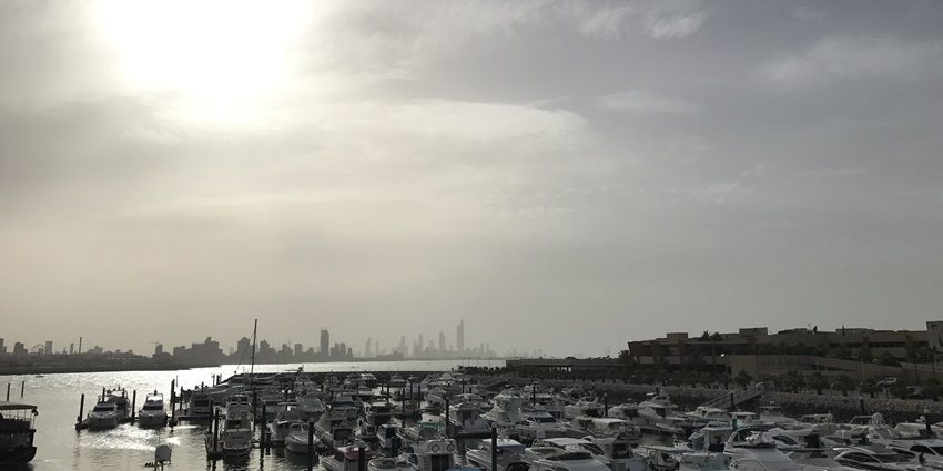 Tiny and isolated Auhah Island, one of the top islands in Kuwait, with flat desert terrain and surrounding reef zones.