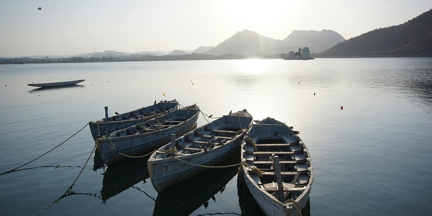 Badi Lake with mountain views and boats is one of the best places to visit in Udaipur.