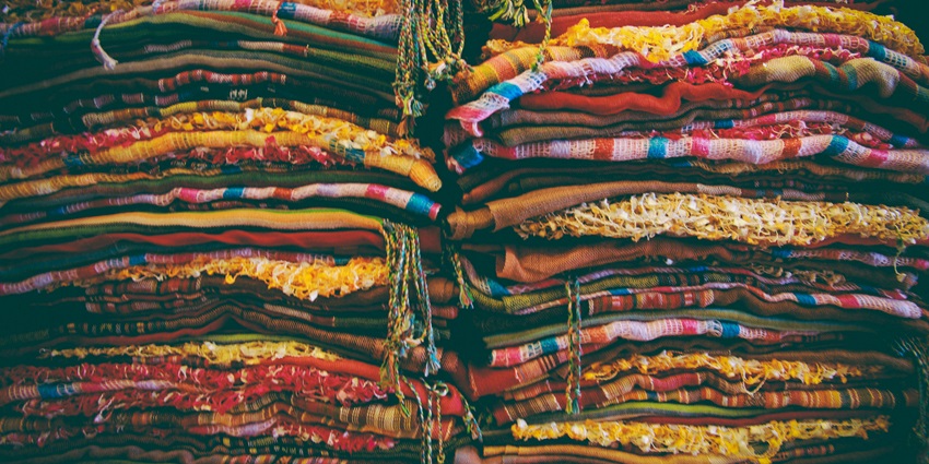 Buy vibrant, geometric-patterned Dhaka fabric traditionally woven by skilled Nepali artisans.
