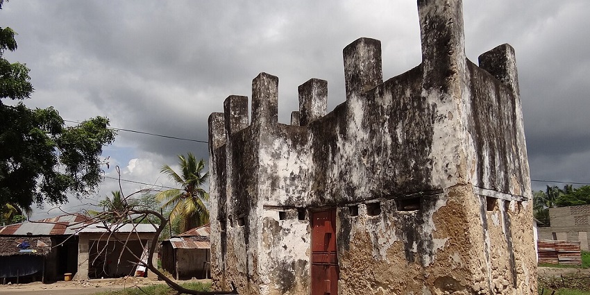 Historic 19th-century block house in Bagamoyo, Tanzania, with weathered stone walls and remnants of colonial architecture.
