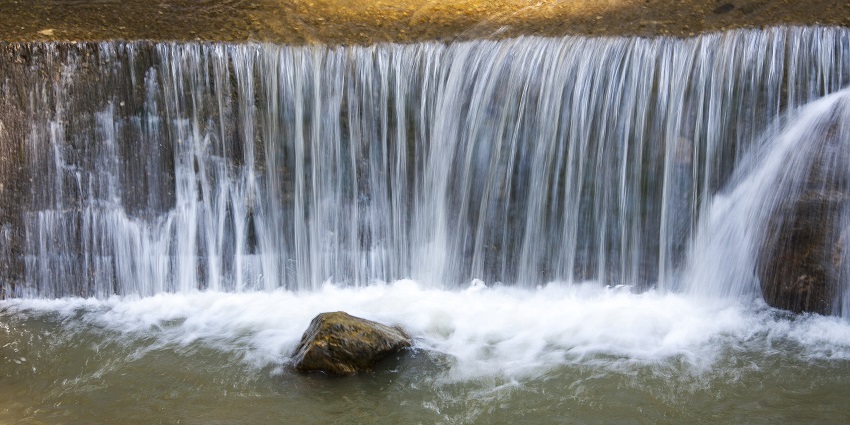 Bakthang Waterfall cascades down rocks amongst the best places to visit in Gangtok in April.