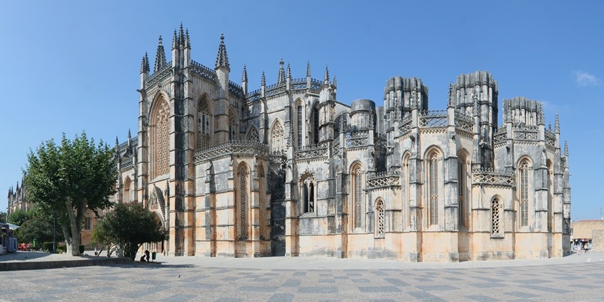 Batalha Monastery under blue skies is one of the must-see Historical Places in Portugal for tourists