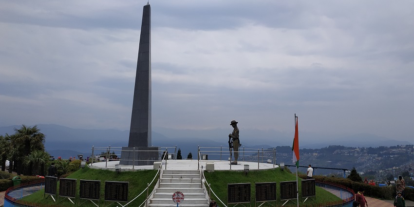 Batasia loop and war memorial with stairs leading to the war memorial, one of top places to visit in Darjeeling in June.