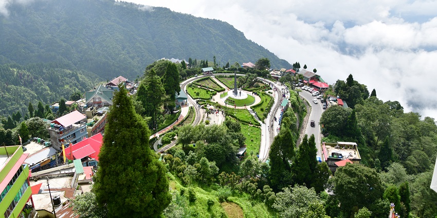 Batasia Loop from above, with a distant war memorial, one of the places to visit in Darjeeling in January.