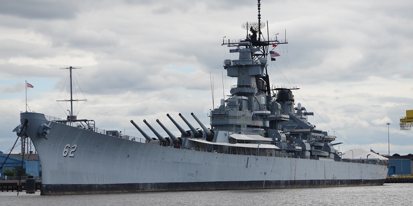 Massive battleship docked on the Delaware River.
