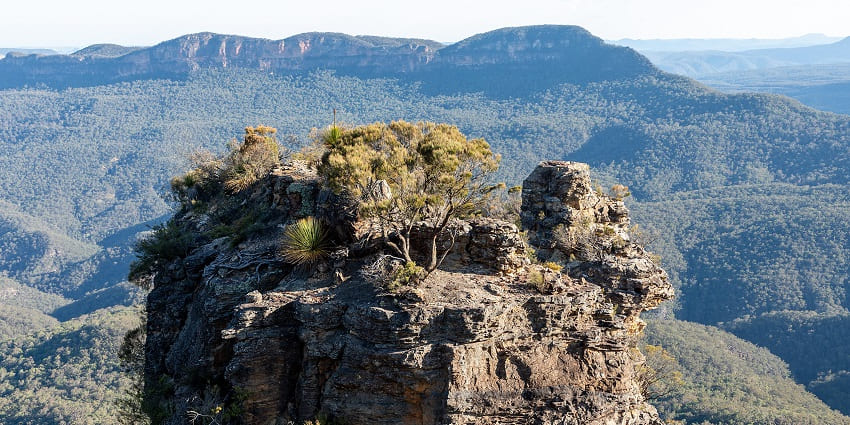 The scenic view of the Blue Mountains National Park on a less crowded day, beneath a clear sky.