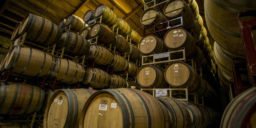 Wooden barrels inside Brasserie Cantillon, a historic brewery in Brussels, Belgium