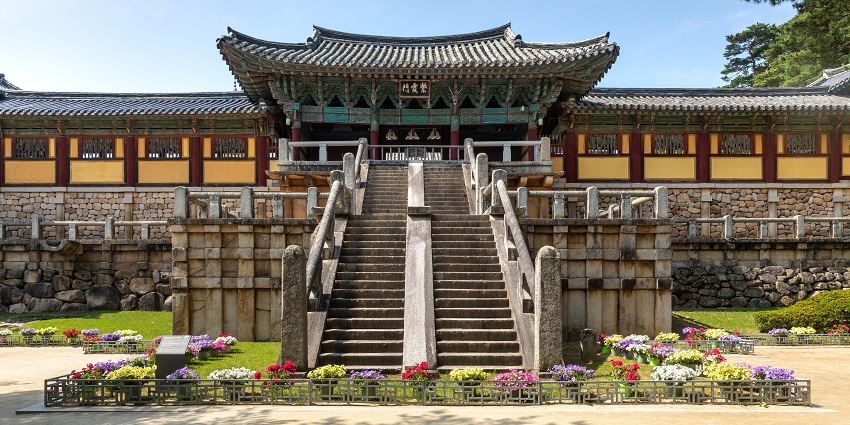 Entrance gate of Bulguksa Temple in Gyeongju, South Korea, with stone stairs, flower beds, one of the top monuments in South Korea.