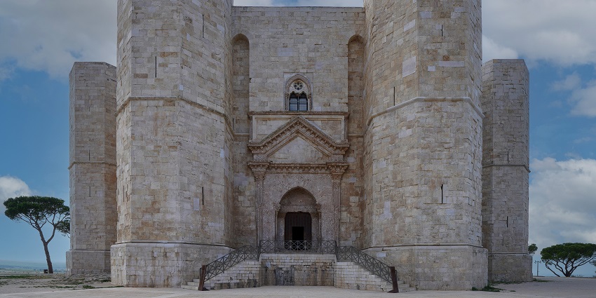 Front facade of Castel del Monte with entrance gate, stairs on both side,s and old architecture