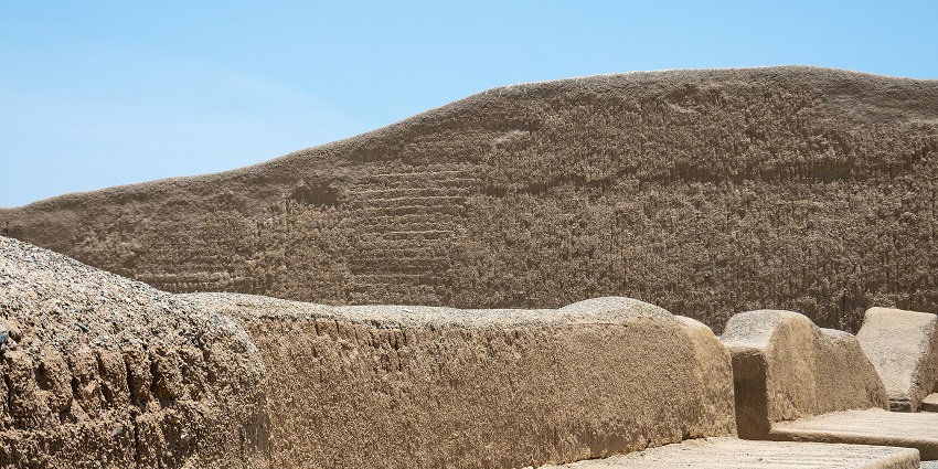 Chan Chan City in Trujillo with mud-brick architecture, a tall mud-brick wall, one of the top historical places in Peru.