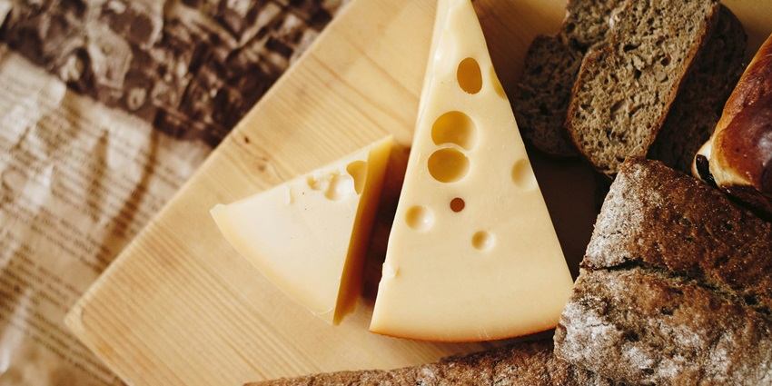 Things to buy in Zürich include gourmet Swiss cheeses arranged in a speciality counter.