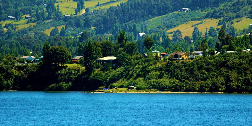 Traditional wooden churches and lush greenery on mystical Chiloé Island, one of the famous islands in Chile.