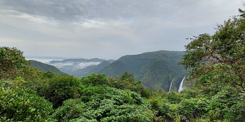 Chorla ghat in Goa from above, surrounded by green mountains and clouds