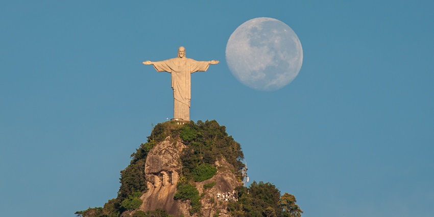 Christ the Redeemer statue on a green hill, one of the historical places in Rio De Janiero