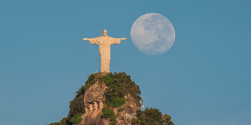 Christ the Redeemer statue, under the blue sky, is the most famous monument in Brazil