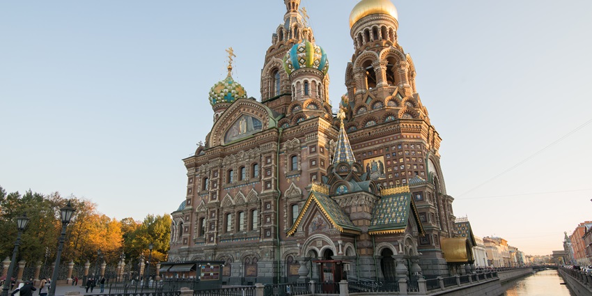 A stunning Russian monument with onion domes, intricate mosaics, and the Griboyedov Canal.