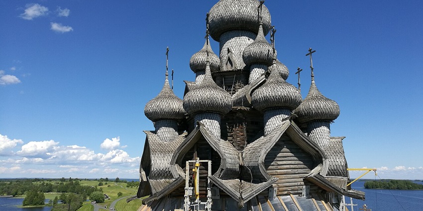 Church of the Transfiguration in Kizhi Island with black-themed architecture and greenery