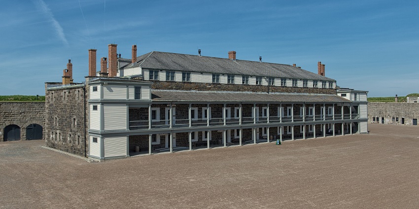 Main building of Halifax Citadel in Nova Scotia with multiple windows, chimneys and pillars