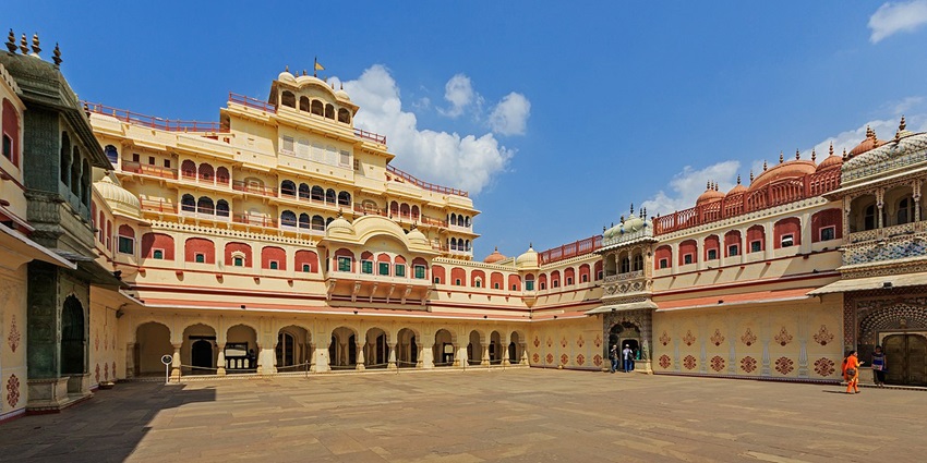 Lavish royal residence showcasing Rajasthani architecture with domes and inner courtyards.