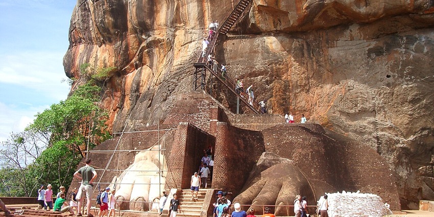 Climbing the Sigiriya Rock Fortress offers a mix of history, art, and sweeping views over the Sri Lankan landscape.