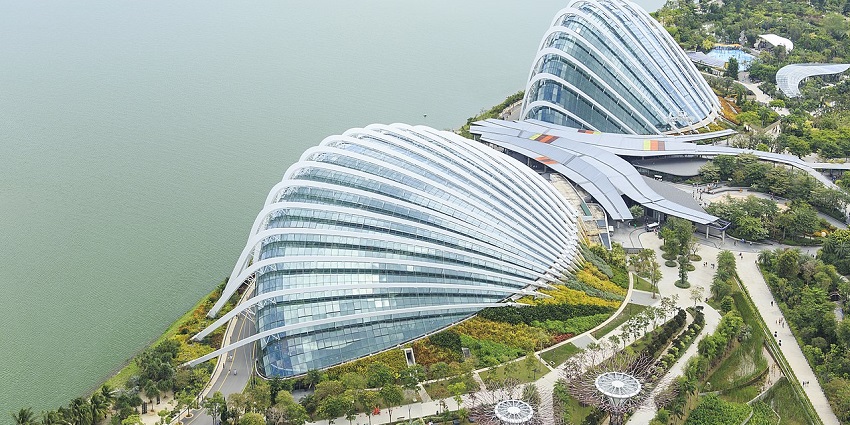 Flower Dome and Cloud Forest at Gardens by the Bay show lush greenery and modern design.
