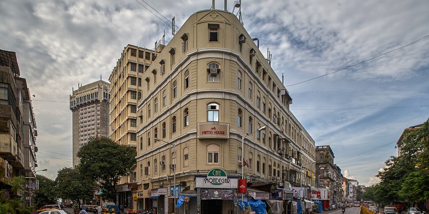 The Colaba Causeway, a Vibrant street shopping lane, is lined with stalls selling clothes.