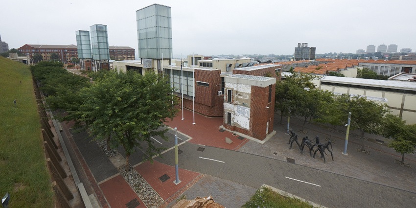 The red brick watchtower and bold signage of Constitution Hill represent justice reform.